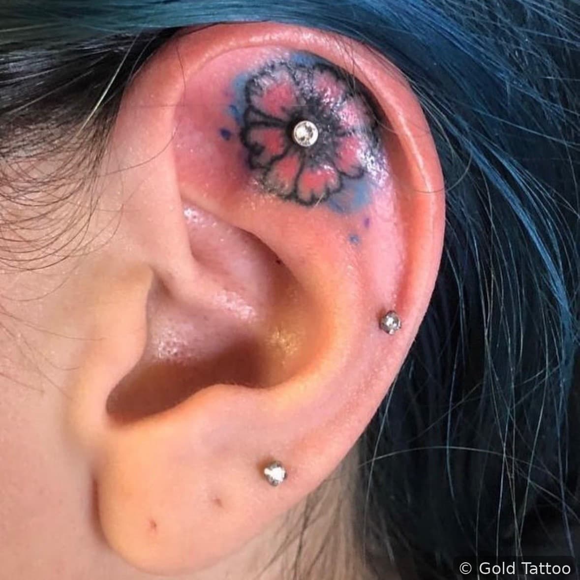 Ear piercings with a flower design by Jordan at Gold Tattoo Vegas, downtown Las Vegas
